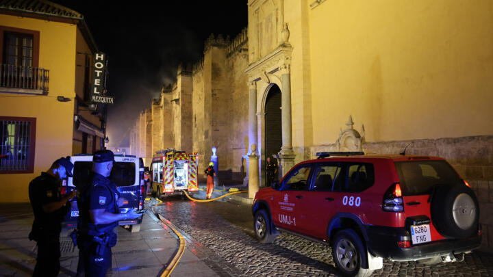 Firefighters work to extinguish a fire which broke out in the historic mosque-turned-cathedral in the southern Spanish city of Cordoba on August 8, 2025.