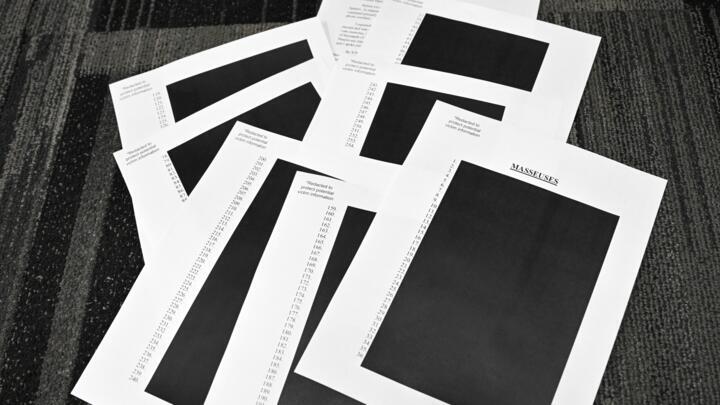 Redacted documents after the US Justice Department began releasing the long-awaited records from the investigation into the politically explosive case of convicted sex offender Jeffrey Epstein