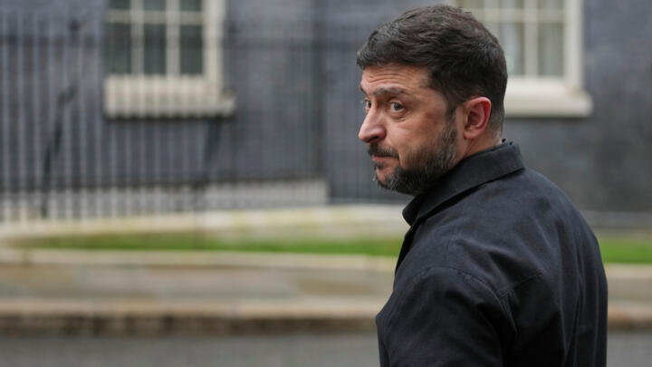 Ukrainian President Volodymyr Zelensky, looks back at the media in Downing Street, London, Monday, Dec. 8, 2025