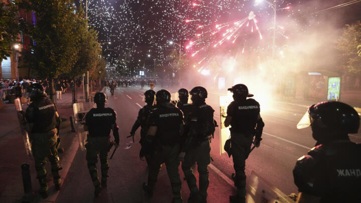 Serbian gendarmerie officers guard street during an anti-government protest near Serbian Progressive Party office in Belgrade, Serbia, Thursday, August 14, 2025.