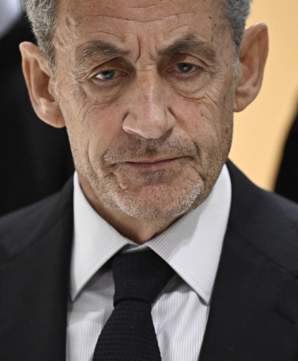 Former French President Nicolas Sarkozy speaks to reporters after the verdict in his trial for illegal financing of his 2007 campaign by Libya, at a Paris court on September 25, 2025.