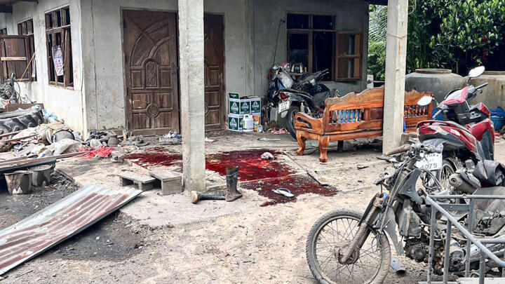 A Royal Thai Army photo taken on July 24, 2025 shows blood stains in front of a house damaged by a rocket strike in Surin province's Kap Choeng district.