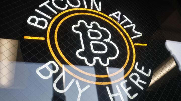 A sign advertises a Bitcoin ATM at a gas station on July 16, 2025 near Pasadena, California.