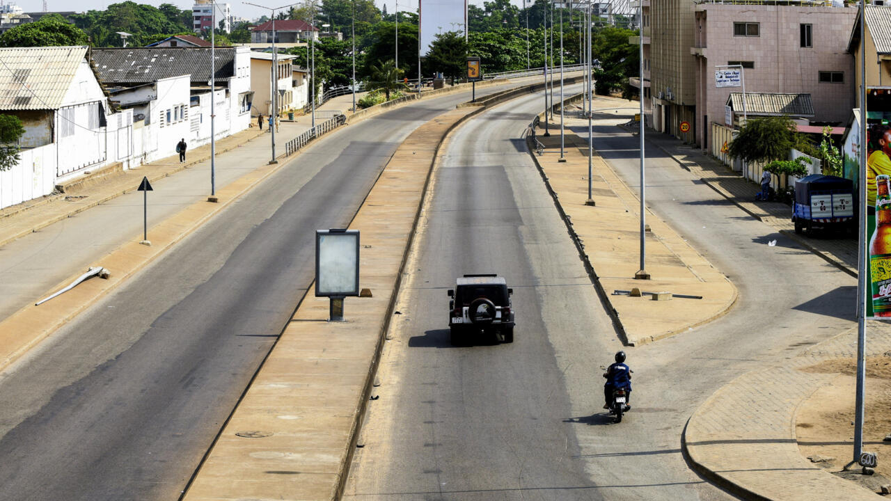 Traffic moves along an empty road following reports of a coup attempt against the government of Benin's President Patrice Talon, in Cotonou, Benin
