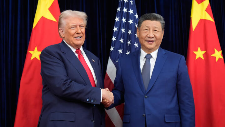 US President Donald Trump, left, and Chinese President Xi Jinping shake hands before their meeting at Gimhae International Airport in Busan, South Korea, Thursday, October 30, 2025. 