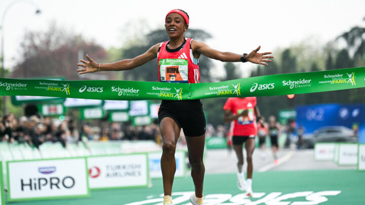 Bedatu Hirpa crosses the finish line to win the women's Paris Marathon. 