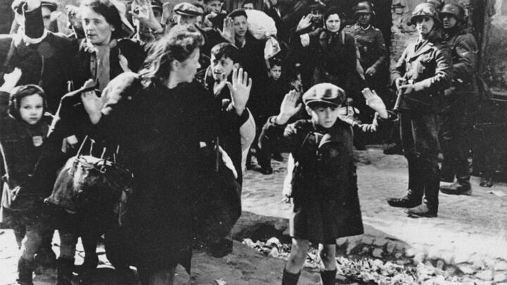 In this April 19, 1943 file photo, a group of Jews are escorted from the Warsaw ghetto by German soldiers.