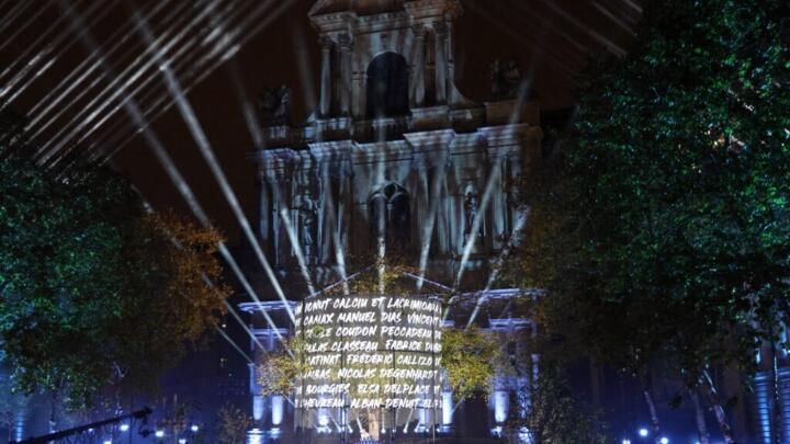 Names of victims are projected during a sound and light show as part of a ceremony marking a decade since the terror attacks of November 13, 2015 in which 130 civilians were killed, at the "Jardin du 13 novembre 2015" in Paris on November 13, 2025.