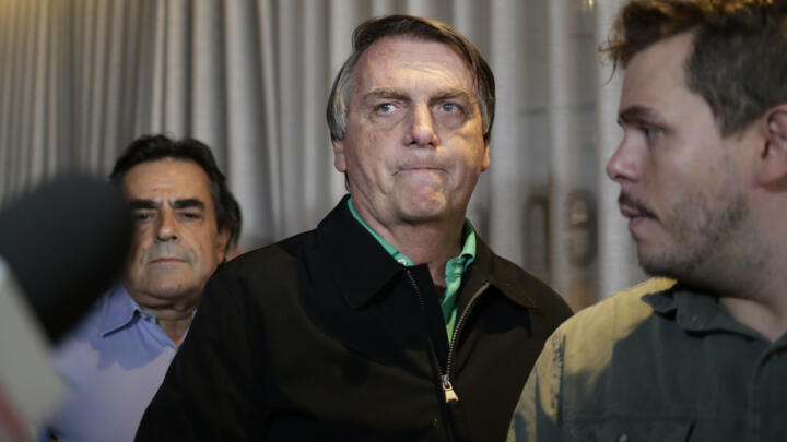 In this file photo, Brazil's former president Jair Bolsonaro prepares to speak to the press at a restaurant in Belo Horizonte on June 30, 2023, the day that judges ruled him ineligible to run for political office until 2030.