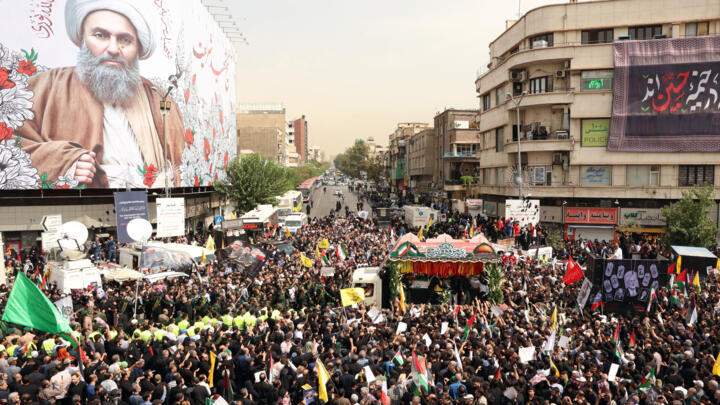 Iranians take part in a funeral ceremony for late Hamas leader Ismail Haniyeh, in Tehran, on August 1, 2024. 