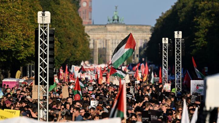 Protesters march at a "Together for Gaza!" demonstration near the Brandenburg Gate in Berlin on September 27, 2025.