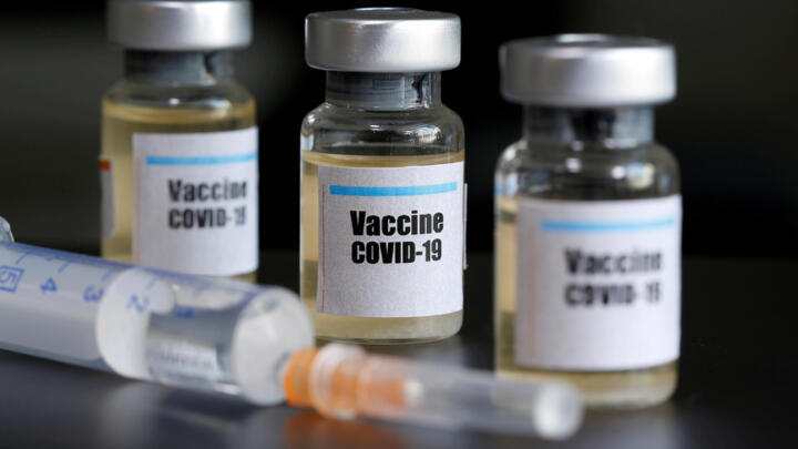 Small bottles labbeled with a "Vaccine COVID-19" sticker and a medical syringe are seen in this illustration taken taken April 10, 2020.