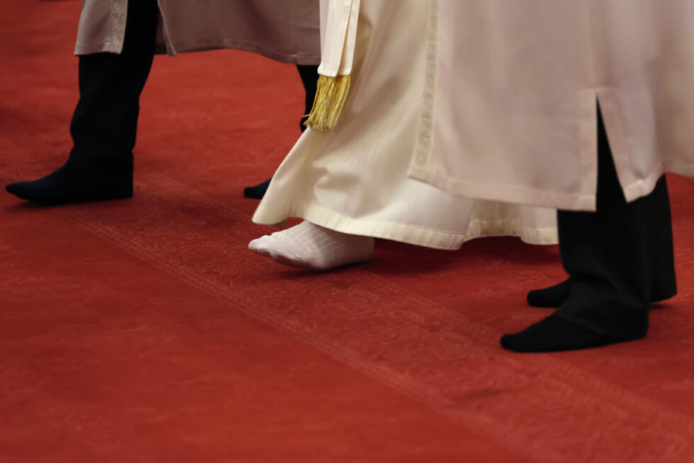 Like all visitors, Pope Leo removed his shoes to enter the mosque, walking around in white socks -- in a likely nod to his favourite baseball team, the Chicago White Sox