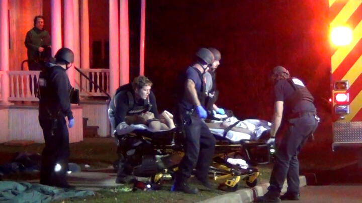 First responders attend to a victim after a gunman shot and wounded three college students of Palestinian descent in Vermont, US, on November 25, 2023.