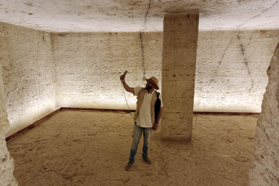 A tourist visits the tomb of King Amenhotep III in the Valley of the Kings near the city of Luxor on October 4, 2025.