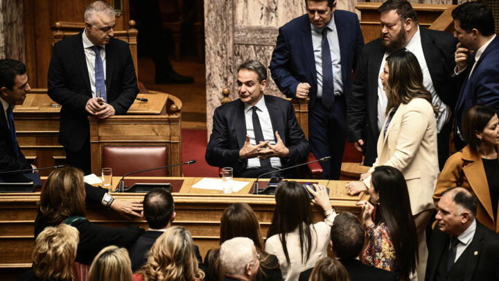 Prime Minister Kyriakos Mitsotakis (C) attends the parliamentary vote on same-sex marriage in Athens, February 15, 2024.