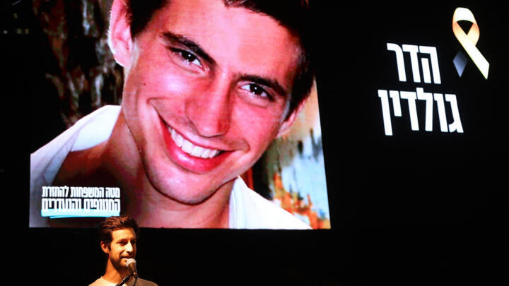 Chemi Goldin, brother of Lt. Hadar Goldin whose body is still held by Hamas in the Gaza Strip speaks during an event at Hostages Square in Tel Aviv on October 28, 2025, during an evening of unity and 