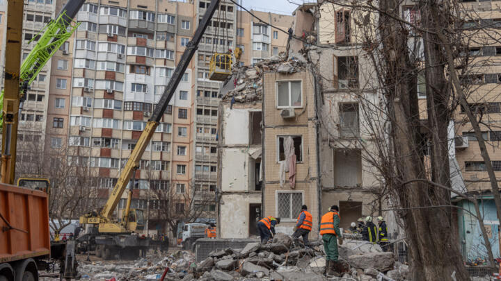 Rescuers clear debris near a multi-story building heavily damaged following a drone strike in Odesa, Ukraine on March 3, 2024, amid the Russian invasion of Ukraine. 