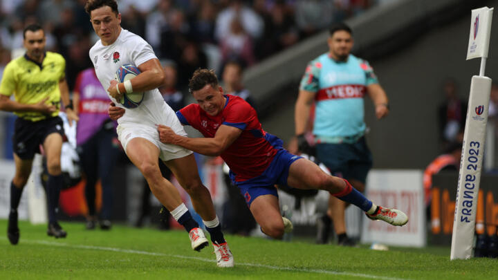 Chile's scrum-half Benjamin Videla (R) tackles England's wing Henry Arundell during the France 2023 Rugby World Cup Pool D match between England and Chile at Stade Pierre-Mauroy in Lille, northern France on September 23, 2023. 