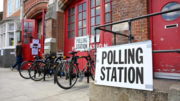 A voter enters a polling station at The Old Fire Station in Hackney, east London, on July 4, 2024 as Britain holds a general election.