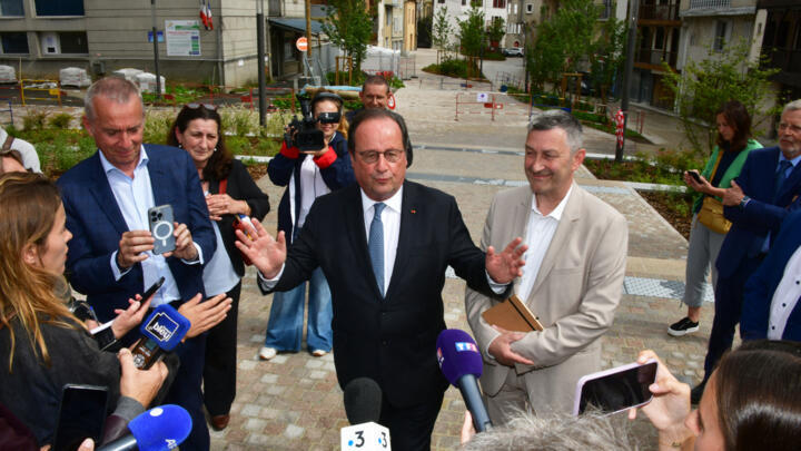 Former president of France and member of the French Socialist Party François Hollande (Centre L) delivers a press conference to announce his candidacy for left-wing coalition New Popular Front in the Correze department of France, ahead of France's upcoming legislative elections, on June 15, 2024.