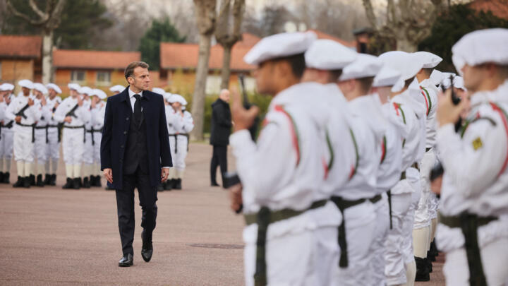 France's President Emmanuel Macron reviews the troops prior to his speech to unveil a new national military service at the military base in Varces, French Alps, November 27, 2025.