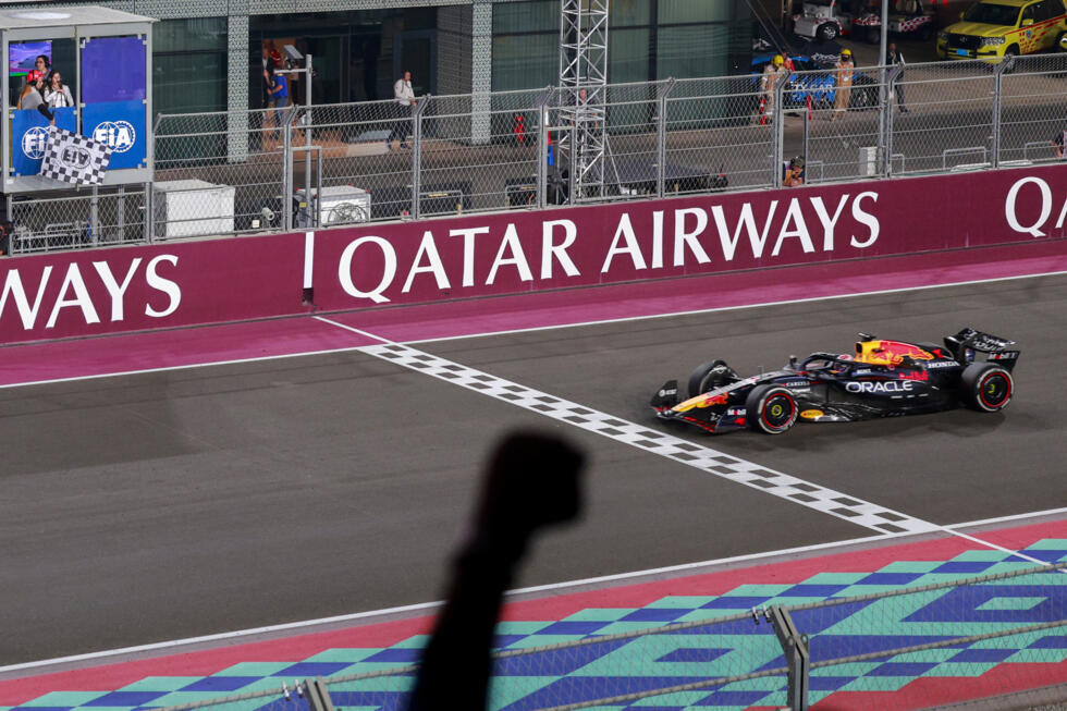 Max Verstappen crosses the line to win the Qatar Grand Prix and take the championship fight to the final weekend