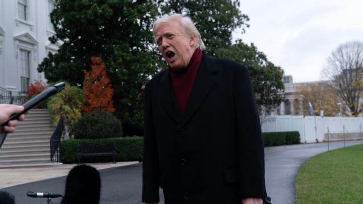 US President Donald Trump talks to reporters as he departs from the South Lawn of the White House.