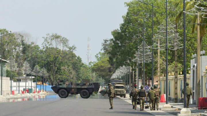 Soldiers patrol in front of the headquarters of Benin's radio and television station, after the country's armed forces thwarted the attempted coup against the government of Benin, Dec.7, 2025.