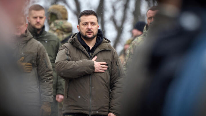 This handout picture taken and released by the Ukrainian Presidential press service on January 29, 2023, shows Ukrainian President Volodymyr Zelensky taking part in a ceremony in Kyiv, to commemorate the 105th anniversary of the Battle of Kruty against Bolshevik Red Army.
