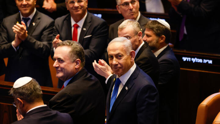 Israeli Prime Minister Benjamin Netanyahu looks on while President Donald Trump addresses the Knesset, Oct. 13, 2025.