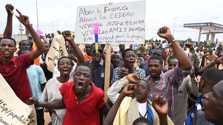 Supporters of Niger's National Council for the Safeguard of the Homeland (CNSP) gather to demonstrate near a French airbase in Niamey on August 11, 2023.