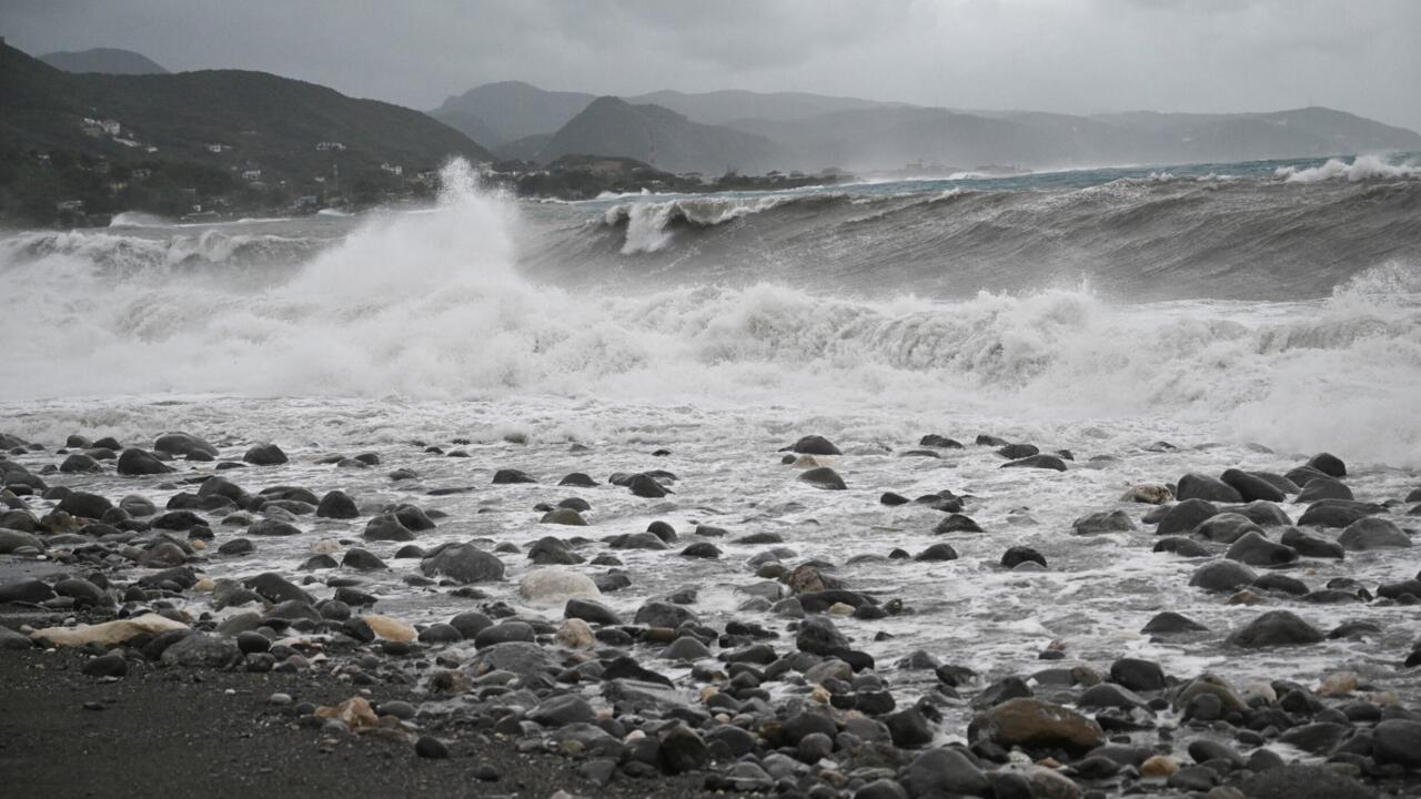 Waves crash onto the beach in Kingston on October 27, 2025; Hurricane Melissa threatened Jamaica with potentially deadly rains after rapidly intensifying into a top-level Category 5 storm