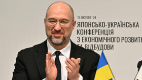 Ukraine's Prime Minister Denys Shmyhal and Japanese Prime Minister Fumio Kishida attend a memorandum of cooperation exchange ceremony  in Tokyo on February 19, 2024.