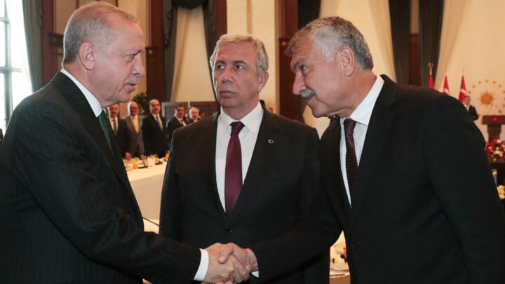 A photo from September 2019 shows Turkey's President Recep Tayyip Erdogan greeting Adana Mayor Zeydan Karalar, one of three mayors arrested on July 5, 2025.
