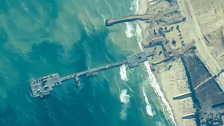 Members of the US Army, US Navy and the Israeli military put in place the Trident Pier on the Gaza coast on May 16, 2024.
