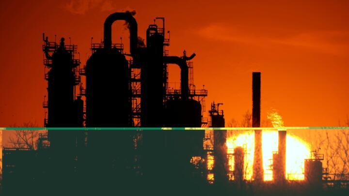 The HF Sinclair El Dorado oil refinery is silhouetted against the sky at sunset March 21, 2025, in El Dorado, Kan.