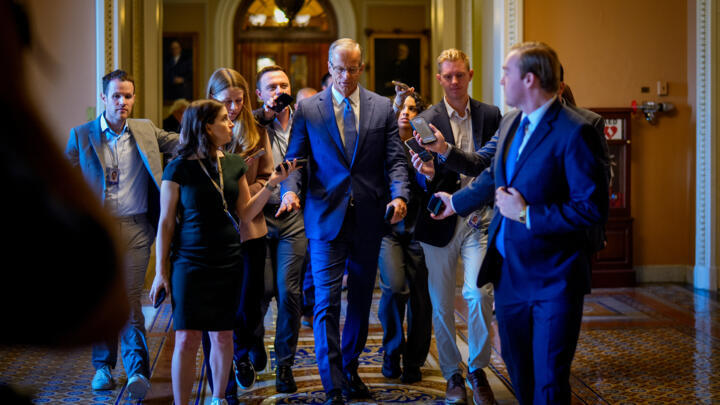 US Senate Majority Leader John Thune speaks to reporters as returns to his office from the Senate Chamber at the US Capitol Building.