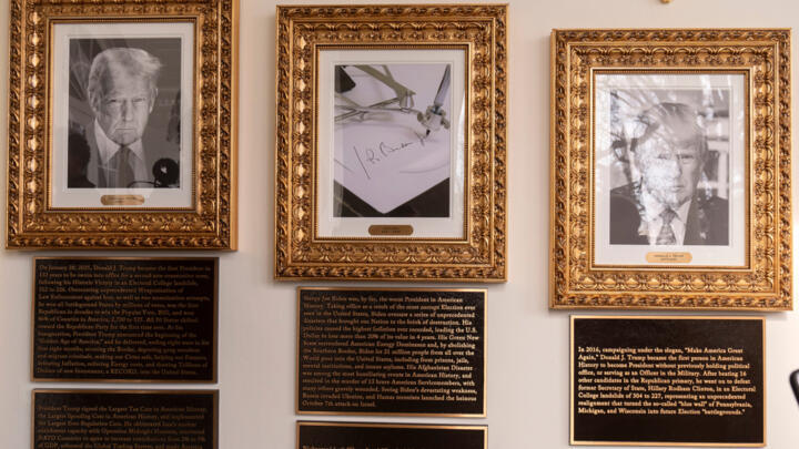 Portraits with new plaques of explanatory text are seen on the Presidential Walk of Fame on the Colonnade of the White House.