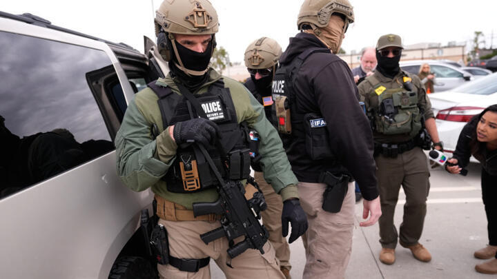U.S. Border Patrol agents arrive at a Home Depot in Kenner, La.,Wednesday, Dec. 3, 2025. (AP Photo/Gerald Herbert)