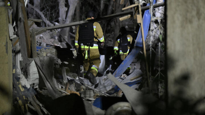 Ukrainian emergency services conduct a search and rescue operation among the rubble of a destroyed hotel following a Russian strike in the town of Kramatorsk early in the morning  on August 25, 2024.