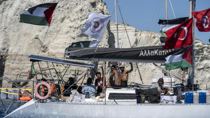 Members of the group of ships of the Global Sumud Flotilla to Gaza are seen moored at the small island of Koufonisi, south of the island of Crete, on September 26, 2025.