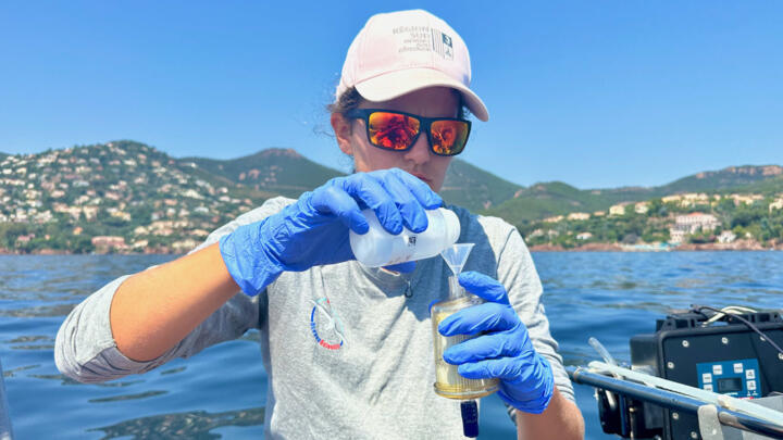 A volunteer from NGO Oceano Scientific takes a DNA sample in the Mediterranean in June 2024.