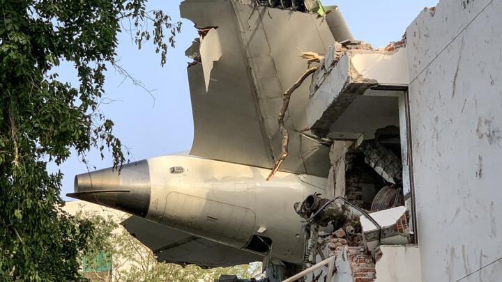 The back of Air India flight 171 is pictured at the site after it crashed in a residential area near the airport in Ahmedabad on June 12, 2025. 