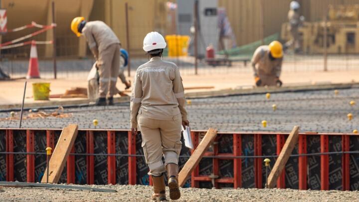 TotalEnergies employees work during construction at a well pad inside Murchison Falls National Park in western Uganda on February 22, 2023.
