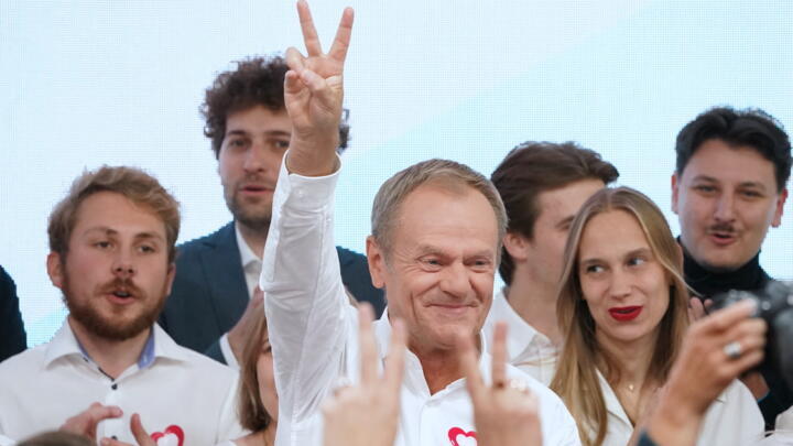 Poland's main opposition leader Donald Tusk, a former prime minister, addresses supporters at his party headquarters in Warsaw on October 15, 2023.
