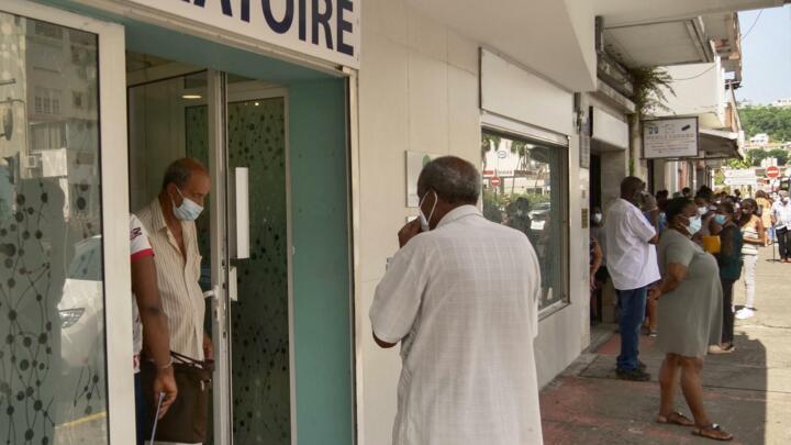 Local residents queue up to take a Covid-19 test at a laboratory in Fort-de-France, on the French Caribbean island of Martinique, on August 2, 2021.