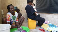 A woman who was gang raped and displaced several times by violence is now living on the floor of an abandoned government ministry building with her six children.