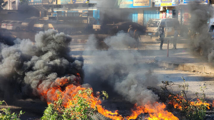 Yemenis burn tyres to protest against dire living condition and the lack basic necessities such as electricity and gas, in Aden on February 6, 2025.