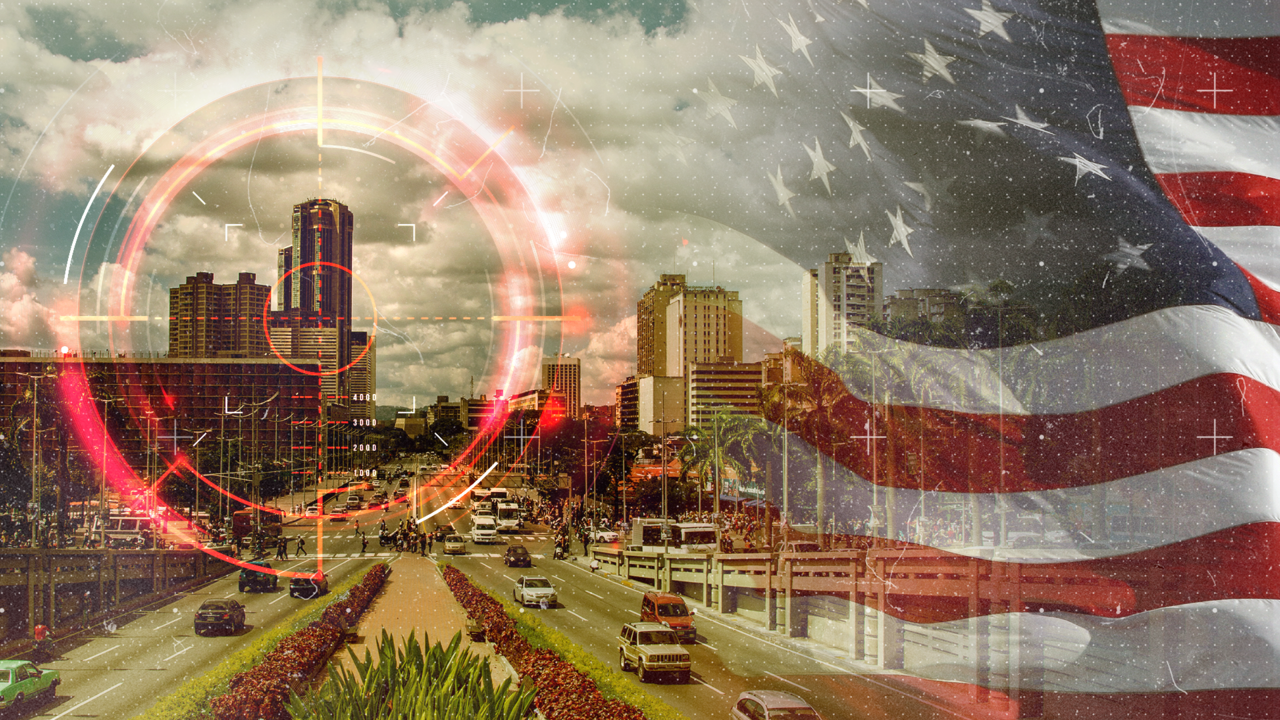 A target superimposed on a photo of Caracas with the United States flag in the background.